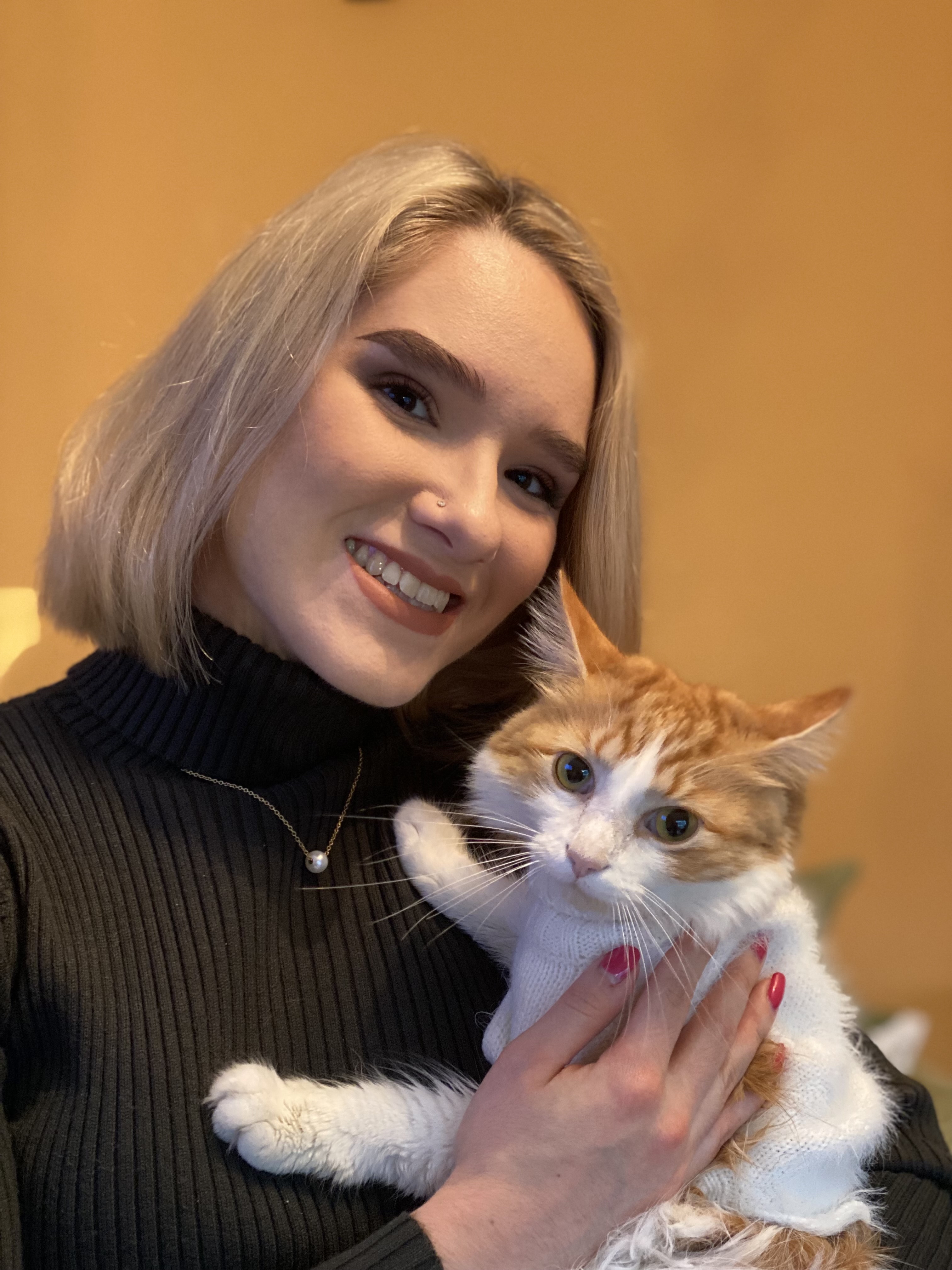 Catie with orange and white cat