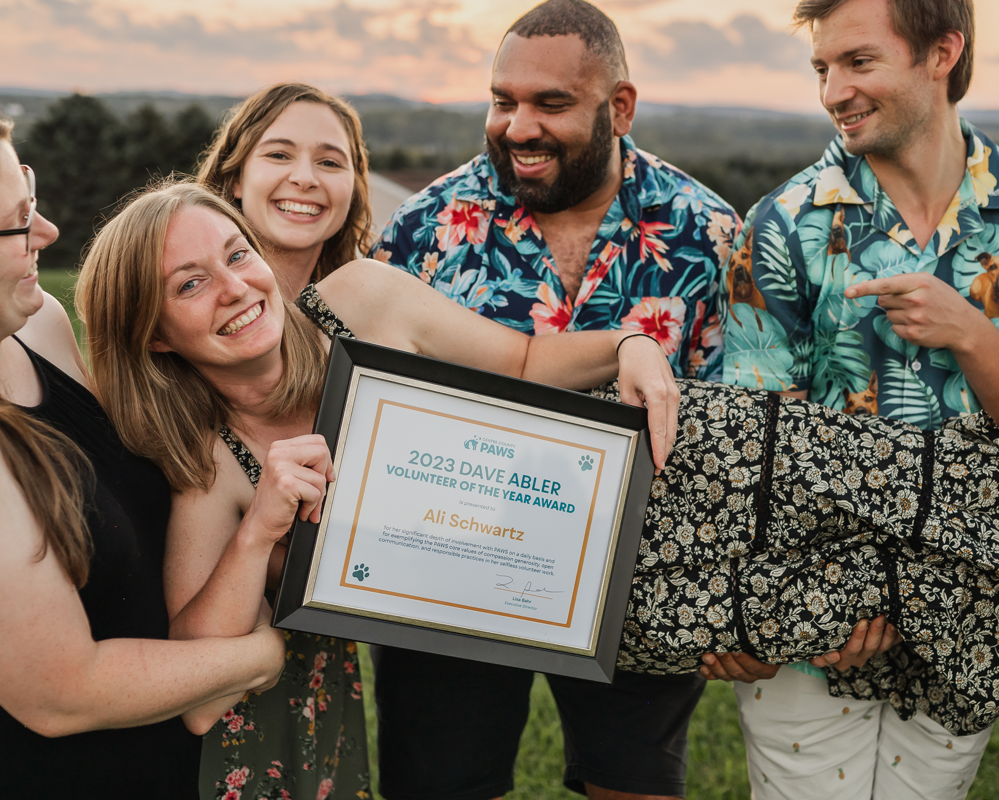 Ali being held by her friends with the DAVY award