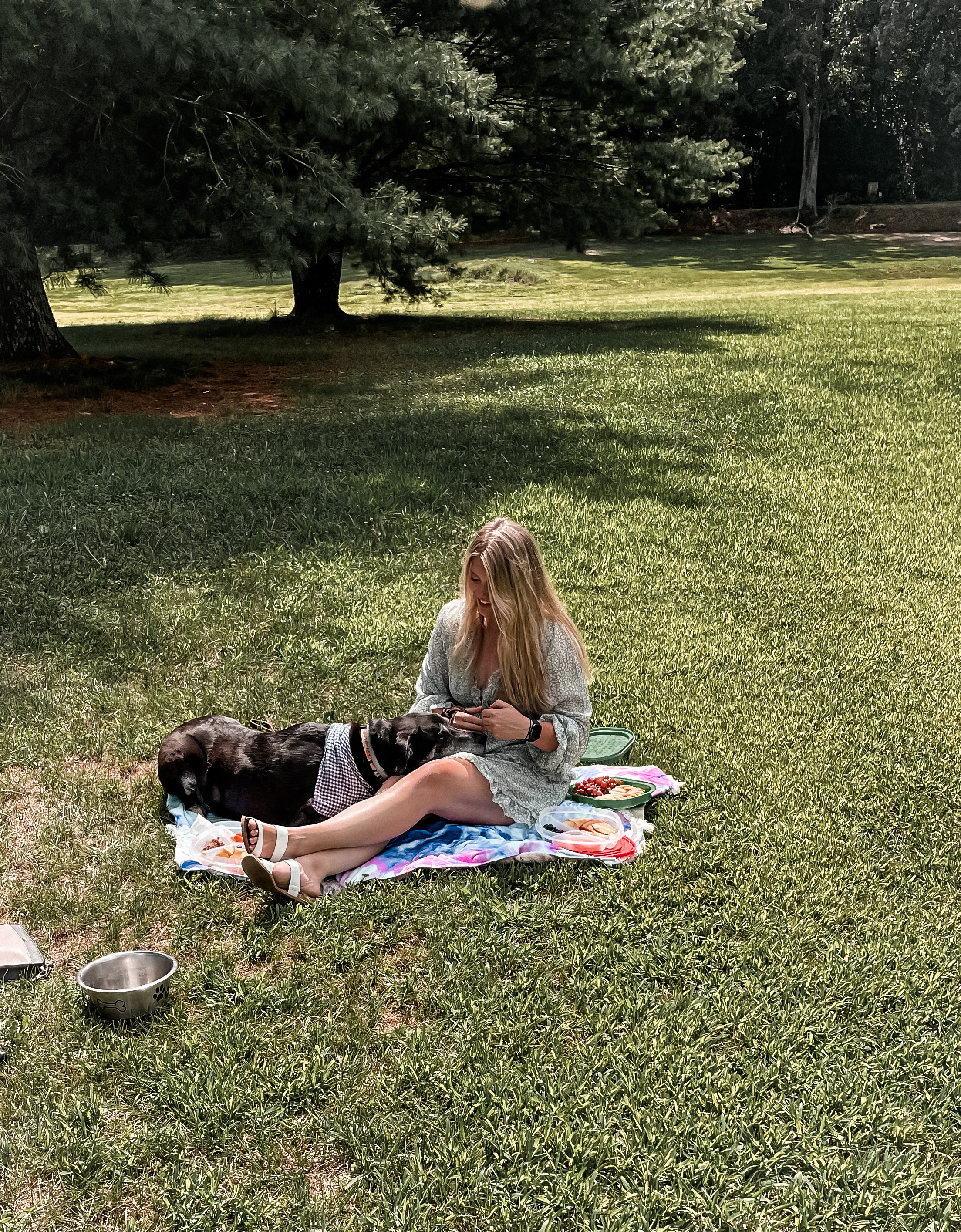 Alysha in a grassy field with dog, Mowgli